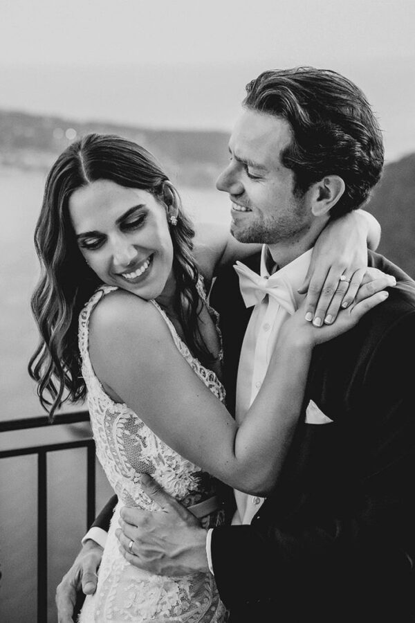 Black and white portrait of a bride and groom embracing at Chateau Eza during an elegant destination wedding in Eze, on the Côte d'Azur.