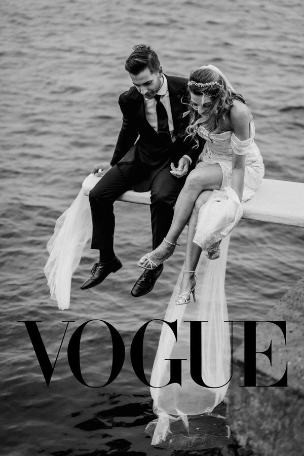 Vogue featured wedding photograph of a bride and groom by the water sitting in a diving board at Belmond Reids Palace in Madeira Island, captured by destination wedding photographer Miguel Ponte.